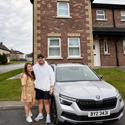 Couple Portrait With House