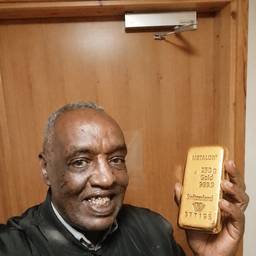 Gold Bar in Hand