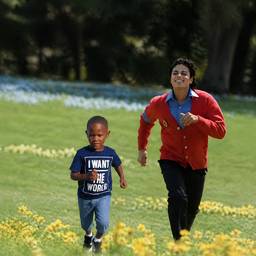 Friends Running in Field