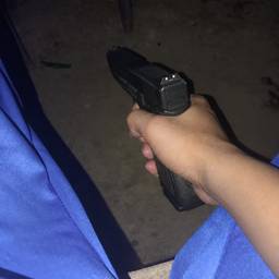 After - Gun In Hand Photo Edit