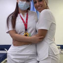 Nurse Friends Hugging Photo