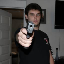 Person Holding Gun