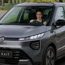 Woman Driving Electric SUV